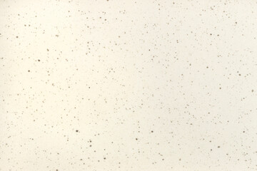 Close-up of spotted beige concrete background. 