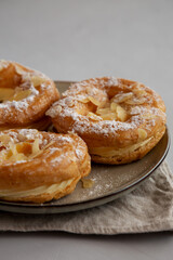 Homemade Paris Brest on a Plate, side view. Close-up. - 783095033