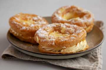 Homemade Paris Brest on a Plate, side view. - 783095041