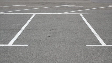 Parking lot markings, black and white stripes. Empty parking place at store