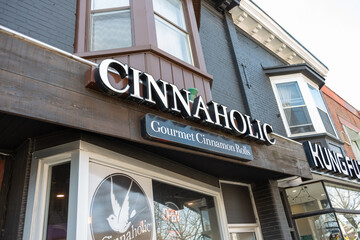 Fototapeta premium exterior building and sign of Cinnaholic, a bakery, located at 319 Danforth Avenue in Toronto, Canada