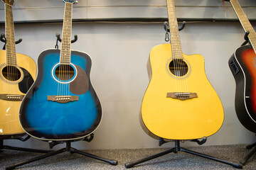 Blue and an yellow guitars at music store
