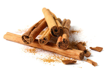 Dry aromatic cinnamon sticks and powder isolated on white