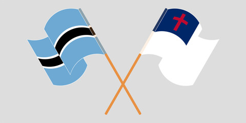 Crossed and waving flags of Botswana and christianity