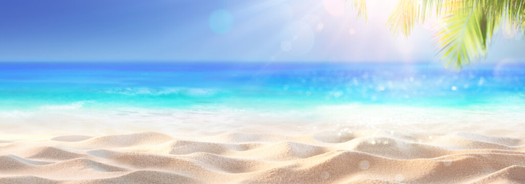 Tropical Sand With Blue Sea And Palm Leaves - Beach Summer Defocused Background With Glittering Of Sunlights