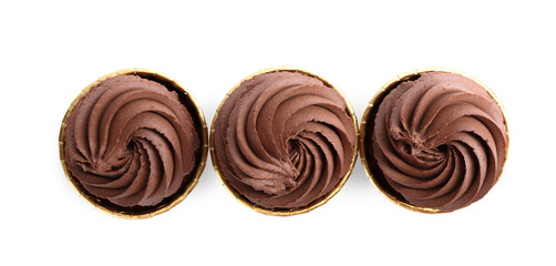 Delicious chocolate cupcakes isolated on white, top view