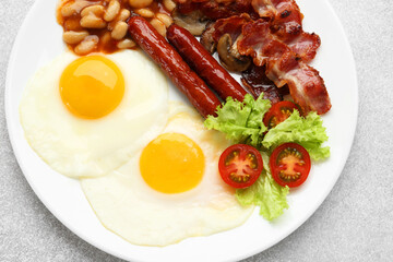 Delicious breakfast with sunny side up eggs on light table, top view