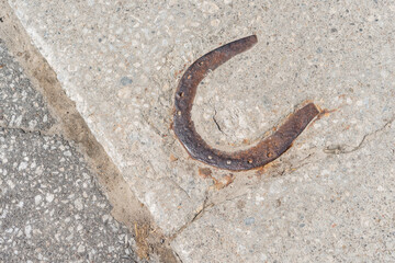 A Solid Foundation of Fortune: This horseshoe, encased in concrete, stands as a testament to the enduring presence of luck and protection in every step of the journey
