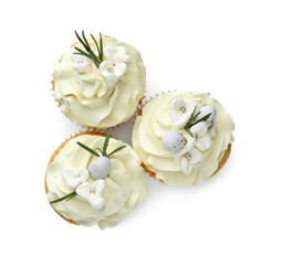 Fototapeta na wymiar Tasty Easter cupcakes with vanilla cream isolated on white, top view