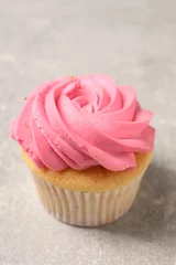 Foto op Aluminium Delicious cupcake with bright cream on gray table © New Africa
