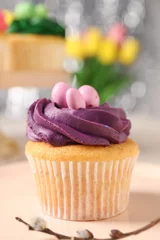 Wandcirkels plexiglas Tasty Easter cupcake with bright cream on table, closeup © New Africa