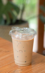 Iced coffee on a wooden table. Strong coffee.