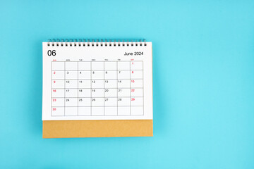 June 2024, Monthly desk calendar for 2024 year on blue background.