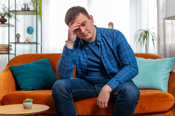 Sad lonely Caucasian man headache looks pensive thinks over life concerns suffers from unfair...