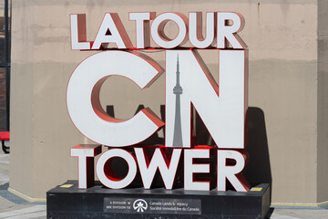 Fototapeta premium La Tour CN Tower sign located outside the modernist tower downtown Toronto, Canada (290 Bremner Boulevard)
