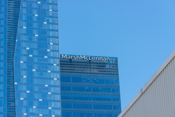 Fototapeta premium rooftop building sign of Marsh & Mclennan Companies, insurance agency, located at Sun Life Centre - Roy Thomson in Toronto, Canada