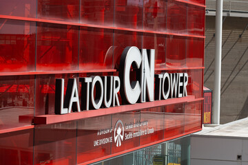 Fototapeta premium La Tour CN Tower sign located outside the modernist tower downtown Toronto, Canada (290 Bremner Boulevard)