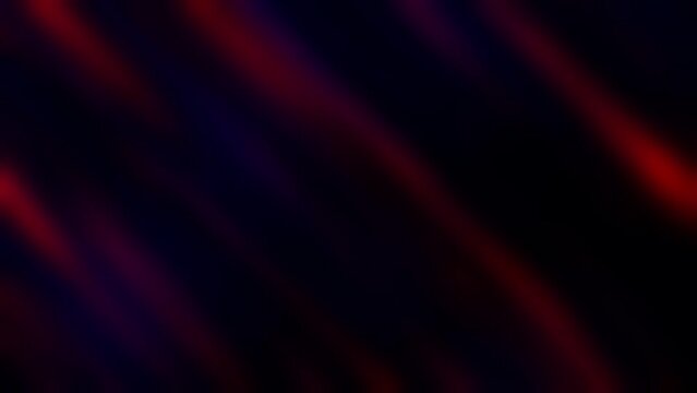 Abstract colored background with glowing moving lines in red and blue. Dark background with bright elements. Video animation with glow. Abstract video of defocused pink light leak gradient