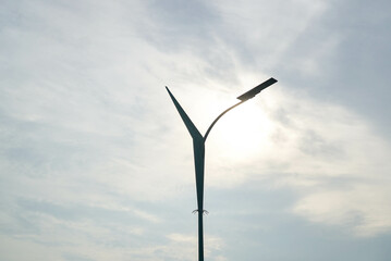 a solar panel lamp on the street