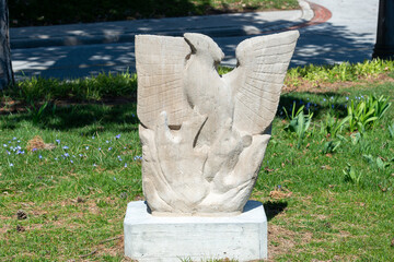 Fototapeta premium stone sculpture (Phoenix) by E B Cox installed at Garden of the Greek Gods (Exhibition Place, Toronto, Canada)