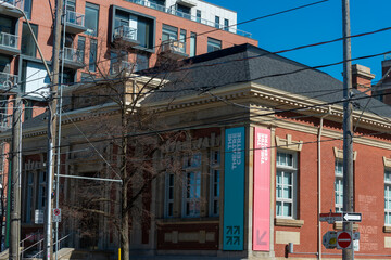 Fototapeta premium exterior building and sign of The Theatre Centre, a performing arts theatre, located at 1115 Queen Street West in Toronto, Canada (formerly a Toronto Public Library, built 1909, funded by A Carnegie)