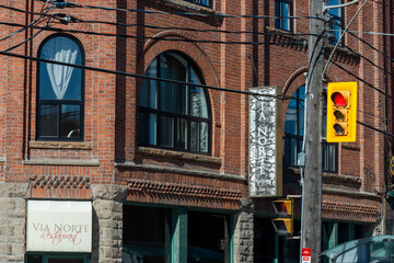 Fototapeta premium exterior building facade and sign of Via Norte Restaurant, a Portuguese restaurant, located at 938 College Street in Toronto, Canada