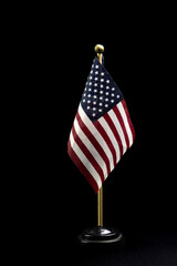 table top USA flag isolated on black background