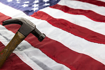 Hammer on USA flag background concept of work