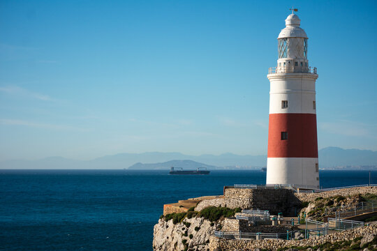 lighthouse at point europe in gibraltar, the southernmost point of europe, where you can appreciate the proximity of the african continent.