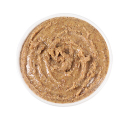 Delicious nut butter in bowl isolated on white, top view