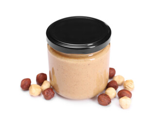 Tasty nut paste in jar and hazelnuts isolated on white