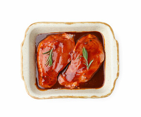 Raw marinated meat and rosemary in baking dish isolated on white, top view