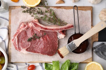 Flat lay composition with raw meat, thyme and marinade on white tiled table