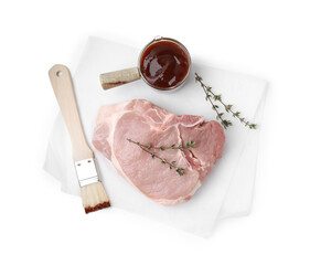 Raw meat, thyme, basting brush and marinade isolated on white, top view