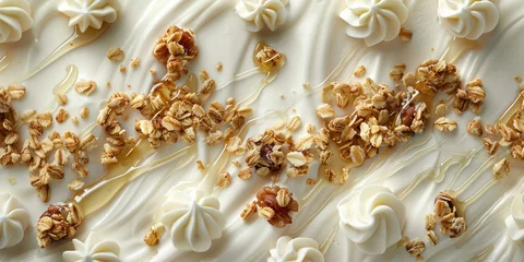 Plexiglas foto achterwand Close up of a delicious cake with white frosting and granola topping on a white plate © SHOTPRIME STUDIO