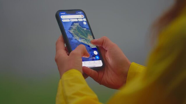 Traveler looking at a map on a mobile phone