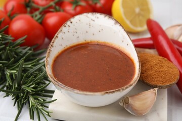 Fresh marinade and ingredients on light table, closeup