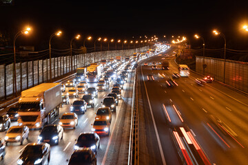 Night time shot of a traffic jam on a main road in Moscow; night view of gridlocked vehicles on a...