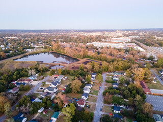 Aerial landscape of forest and suburban neighborhood at sunset in Augusta Georgia