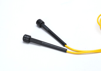 yellow black skipping rope isolated on white background