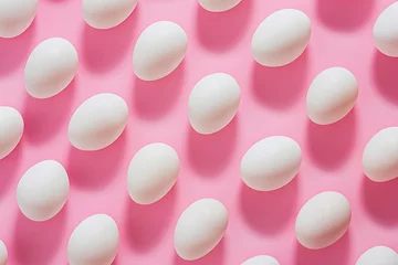 Gordijnen Row of white eggs on pink surface with pink background, Easter concept © SHOTPRIME STUDIO