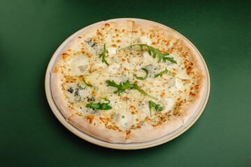 Delicious cheesy pizza isolated on green background. Italian food concept, fast food delivery