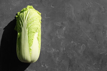 Fresh ripe Chinese cabbage on textured table, top view. Space for text