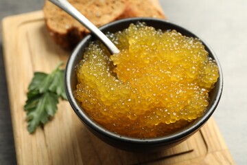 Fresh pike caviar in bowl on table, closeup