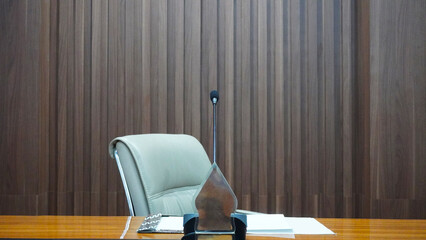 selective focus table microphone with white chair in the meeting room for teleconference           ...