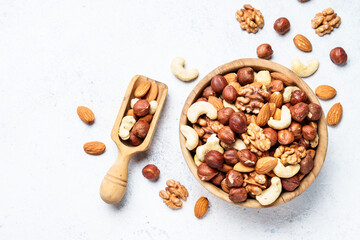 Nuts assortment at white background. Almond, hazelnut, cashew in wooden bowl. Top view - 783201866