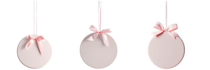 Naklejka premium Set of simple white flat ceramic round ornament hanging on pink ribbon, Christmas decor, isolated on transparent background
