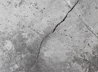 Grey wall with cracks. Concrete texture background.