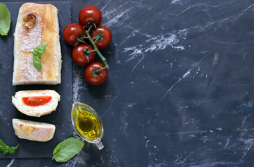 Italian ciabatta bread with tomatoes and olive oil - obrazy, fototapety, plakaty