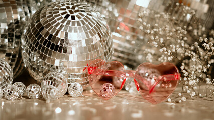 Discoballs with pink sunglasses ready for a new years eve party